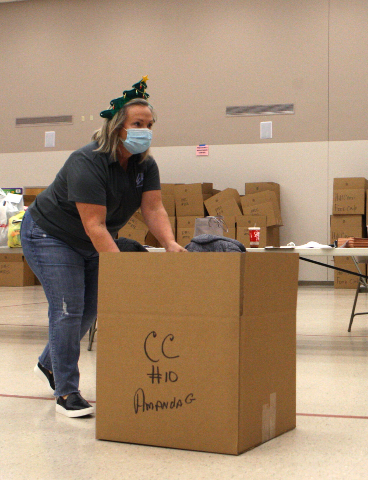 Vicki Fritz pushes a filled donation box